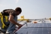 Photo of Steve Emling installing solar panels