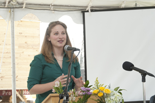 Photo of team leader presenting at an event