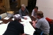 Photo of team members discussing drawing details with mentor Charlie Berliner